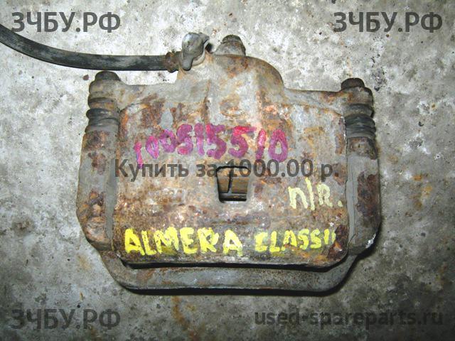 Nissan Almera Classic Суппорт передний правый (в сборе со скобой)