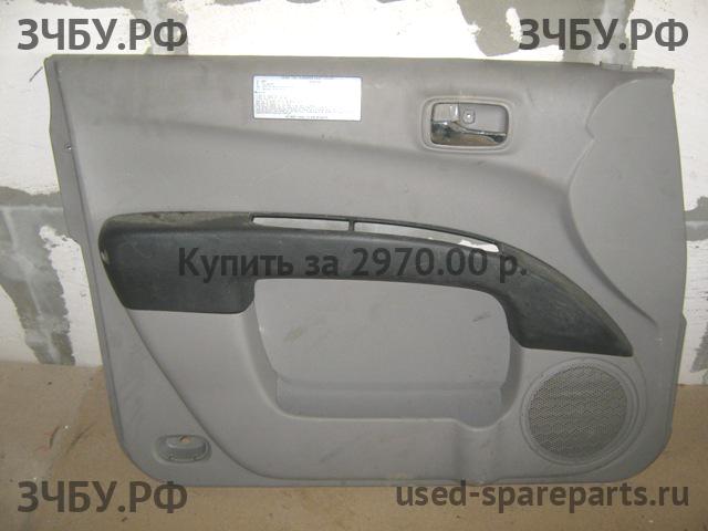 Mitsubishi L200 (4)[KB] Обшивка двери передней левой